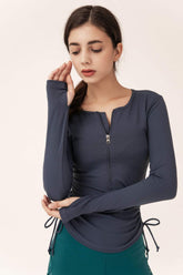 Langärmliges Sporttop mit halbem Reißverschluss und Kordelzug